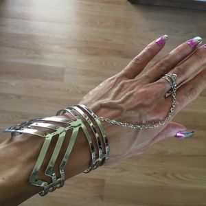 Women’s bracelet with attached ring. Silver